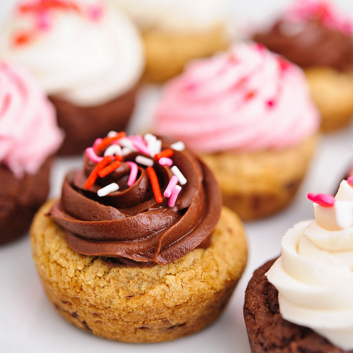 close up of valentines day cookie cupcakes with chocolate and pink frosting